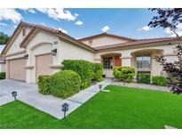 Charming home with a well-maintained lawn and tidy landscaping at 10213 Treasure Mountain Ct, Las Vegas, NV 89129