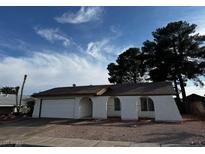 Charming single story home featuring a garage and unique architectural details at 1126 Azul Way, Boulder City, NV 89005