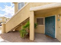 Inviting apartment exterior with an open stairway and security door at 1570 Jamielinn Ln # 104, Las Vegas, NV 89110