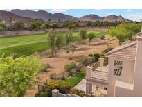 A balcony overlooks the backyard with golf course views and desert landscape, creating a serene outdoor space at 2933 Red Springs Dr, Las Vegas, NV 89135