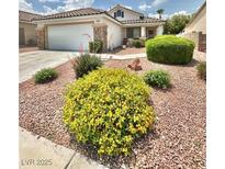 Charming single story home with manicured landscaping and a two-car garage at 3329 Hidden Ridge St, Las Vegas, NV 89129