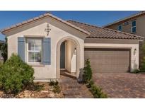 Charming single-story home with blue shutters, a two-car garage, and a covered entrance at 3430 Oristano Ln, Henderson, NV 89044