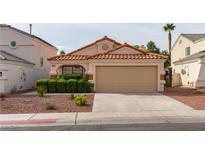 Charming single-story home with a well-manicured front yard and a two-car garage at 368 Legacy Dr, Henderson, NV 89014