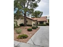 Charming single-story home features desert landscaping and a large shade tree at 3987 Saddlewood Ct, Las Vegas, NV 89121