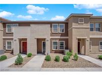 Inviting two-story townhomes with well-maintained landscaping and charming curb appeal at 471 Secret Cove Ct, Henderson, NV 89002