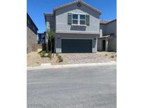 Charming two-story home with a paved driveway and well-maintained landscaping at 6574 Tumoulin St, Las Vegas, NV 89148