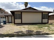 Modest single-story home featuring a low-pitched roof and minimal landscaping in the front yard at 681 Pine Ridge Dr, Las Vegas, NV 89110