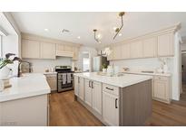 Beautiful kitchen with stainless steel appliances, a center island, and sleek countertops at 7825 Desert Bell Ave, Las Vegas, NV 89128