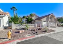 Charming single-Gathering home featuring a well-maintained yard, tile roof, and an attached two-car garage at 8052 Marbella Cir, Las Vegas, NV 89128