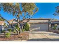 Charming single-story home featuring a two-car garage and mature landscaping in a desirable neighborhood at 10309 Broom Hill Dr, Las Vegas, NV 89134