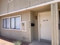 Inviting exterior view featuring a cozy entrance and well-lit facade of the home at 2574 Paradise Village Way, Las Vegas, NV 89120