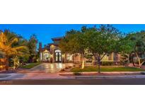 A charming single-Gathering home with a well-manicured lawn and mature trees creates great curb appeal at 3051 Traverse Creek Ln, Las Vegas, NV 89135