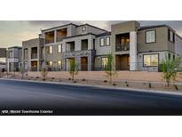 Contemporary townhome exterior featuring multiple stories, balconies, and modern architectural details at 321 Cymbal Pl # Lot 130, Henderson, NV 89015