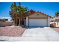 Charming single-story home with a two-car garage and desert landscaping at 684 Whispering Palms Dr, Las Vegas, NV 89123