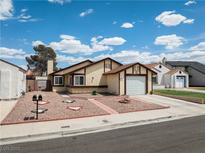 Charming single-story home with manicured front yard and attached garage in a quiet neighborhood at 7268 Wichita Ct, Las Vegas, NV 89119