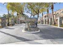The Terraces on the Green entrance shows beautiful landscaping and well maintained grounds at 805 Dana Hills Ct # 104, Las Vegas, NV 89134