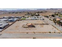 Desert homesite with a small casita, offering expansive views and development potential in a quiet residential area at 8430 Gagnier Blvd, Las Vegas, NV 89113