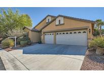 Charming home featuring a spacious two-car garage and well-maintained landscaping at 8840 Arroyo Azul St, Las Vegas, NV 89131