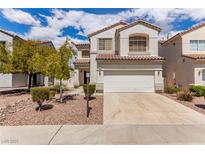 Charming two-story home with a well-manicured front yard and attached two-car garage at 9740 Floweret Ave, Las Vegas, NV 89117