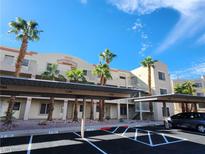 Inviting condo complex with covered parking, manicured grounds, and desert landscaping at 2020 Mesquite Ln # 205, Laughlin, NV 89029