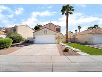 Charming single-Gathering home boasts a two-car garage and a well-manicured front yard in a suburban neighborhood at 2046 Waverly Cir, Henderson, NV 89014