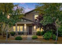 Charming two-story home with landscaped yard and cozy porch at 3141 Monet Sunrise Ave, Henderson, NV 89044