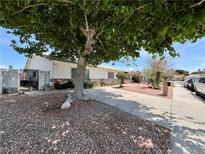Charming single-story home with low-maintenance landscaping and a long, paved driveway at 3144 Downing Pl, Las Vegas, NV 89121