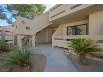 Condo building exterior featuring desert landscaping and stucco facade at 3791 Desert Marina Dr # 109, Laughlin, NV 89029
