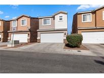 Charming townhomes featuring well-maintained landscaping and attached two-car garages, perfect for modern living at 4076 Rocky Beach Dr, Las Vegas, NV 89115