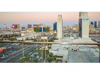 Breathtaking Las Vegas strip view featuring iconic landmarks, hotels, and casinos during a stunning sunset from balcony at 4381 W Flamingo Rd # 2302, Las Vegas, NV 89103