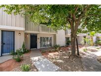 Charming two-story townhome featuring a private entrance and landscaped front yard at 516 Delfern Ln, Las Vegas, NV 89169