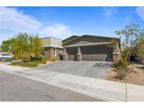 Charming single-story home with a spacious two-car garage and a beautifully landscaped front yard in a residential neighborhood at 6270 Lamont Hills Ave, Las Vegas, NV 89139