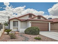 Charming single-story home with a well-maintained front yard and a two-car garage at 6417 Plumcrest Rd, Las Vegas, NV 89108