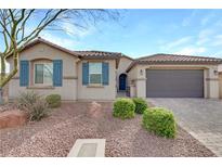 Charming single-story home with desert landscaping, a paver driveway, and a two-car garage at 6814 Willowcroft St, Las Vegas, NV 89149