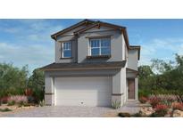 Charming two-story home with a neutral palette, integrated two-car garage, and landscaped front yard at 77 Tardando St, Henderson, NV 89015