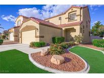 Two-story stucco home with a red tile roof, well-manicured lawn, and a two-car garage at 7916 Nesting Pine Pl, Las Vegas, NV 89143