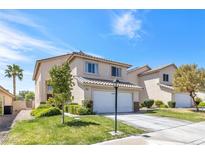 Charming two-story home with a well-maintained front yard and a two-car garage at 9013 Meisenheimer Ave, Las Vegas, NV 89143