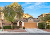 Charming two-story home with a well-manicured front yard and a two-car garage at 10754 Balmoral St, Las Vegas, NV 89141