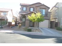 Two-story stucco home featuring a small front yard and an attached one car garage at 1158 Gecko Rd, Henderson, NV 89002