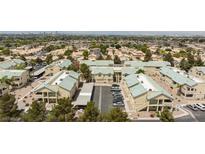 Wide aerial view of well-maintained community with mature landscaping and ample parking at 1509 Linnbaker Ln # 203, Las Vegas, NV 89110