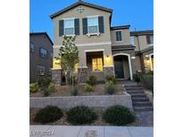 Charming two-story home with well-manicured landscaping and inviting entrance at 2444 Padulle Pl, Henderson, NV 89044