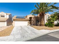 Charming single-story home featuring desert landscaping, solar panels, and a two-car garage at 2805 Rungsted St, Las Vegas, NV 89142