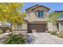 Charming two-story home with a well-maintained front yard and a two-car garage at 2951 Overlook Brook St, Las Vegas, NV 89156