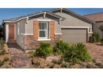 Charming single-Gathering home with brick accents, manicured landscaping, and a two-car garage at 3434 Oristano Ln, Henderson, NV 89044