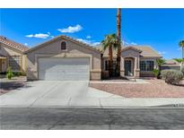 Charming single-story home with a well-maintained front yard, two-car garage, and desert landscaping at 444 Flores Cir, Las Vegas, NV 89123