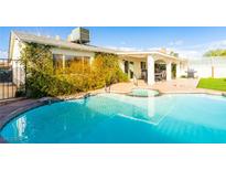 Inviting pool and covered patio, perfect for outdoor relaxation and entertaining at 4471 Wisconsin Ave, Las Vegas, NV 89104