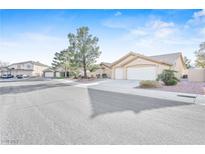 Charming single-story home with a well-maintained front yard and attached two-car garage at 5405 Lucky Clover St, Las Vegas, NV 89149