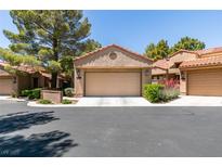 Charming home with a two-car garage, desert landscaping, and a tile roof at 7217 Mission Hills Dr, Las Vegas, NV 89113
