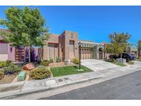 Attractive single-story home featuring a well-manicured lawn and a charming desert landscape at 130 Twin Towers Ave, Las Vegas, NV 89123