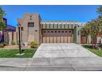 Inviting single-story home featuring a spacious driveway and appealing desert landscaping at 130 Twin Towers Ave, Las Vegas, NV 89123